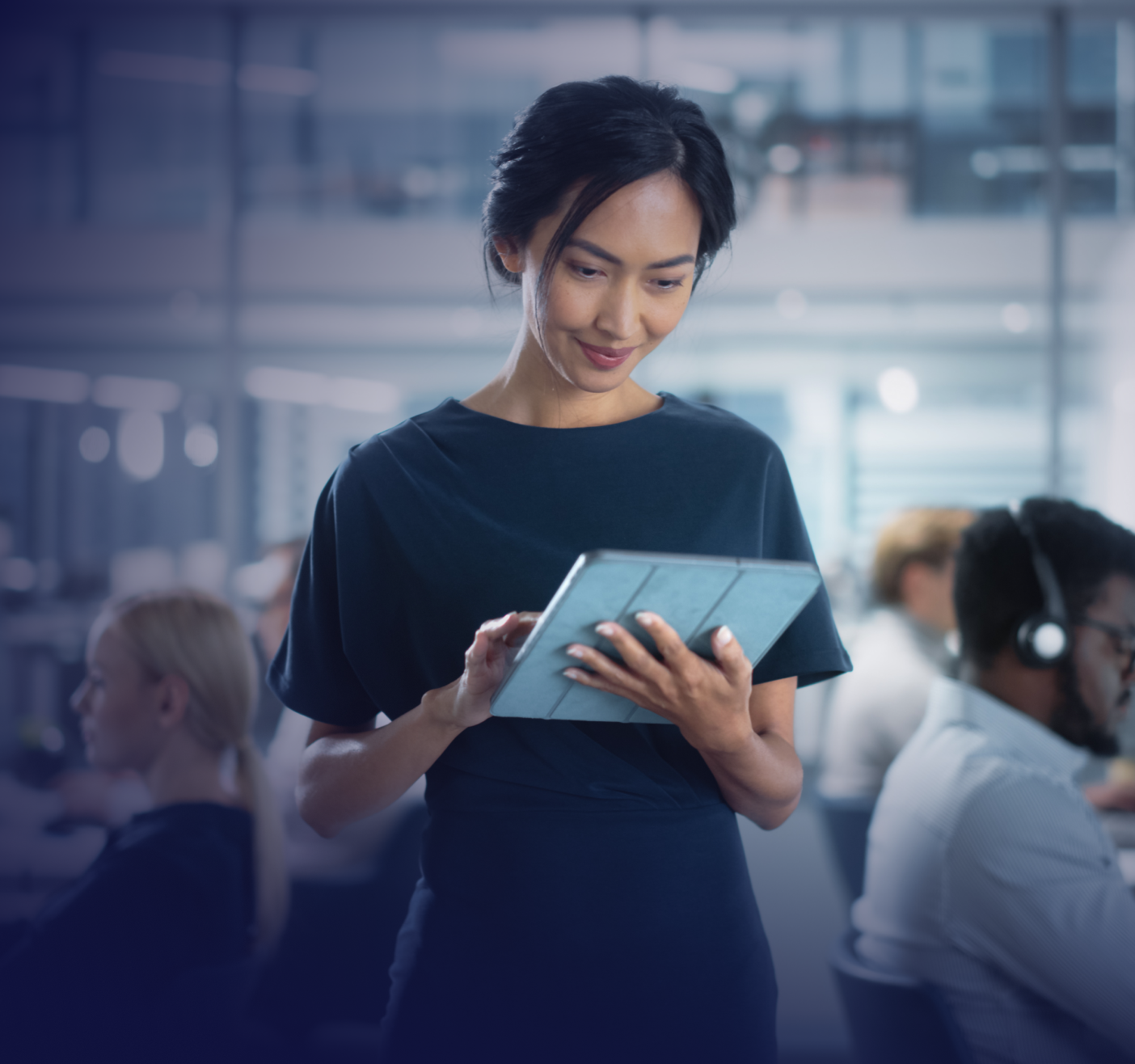 office worker looking at tablet