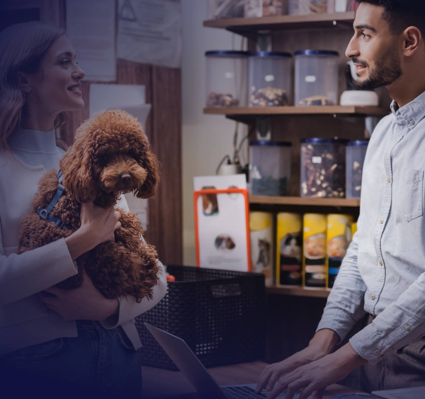 woman with dog speaking with pet store associate