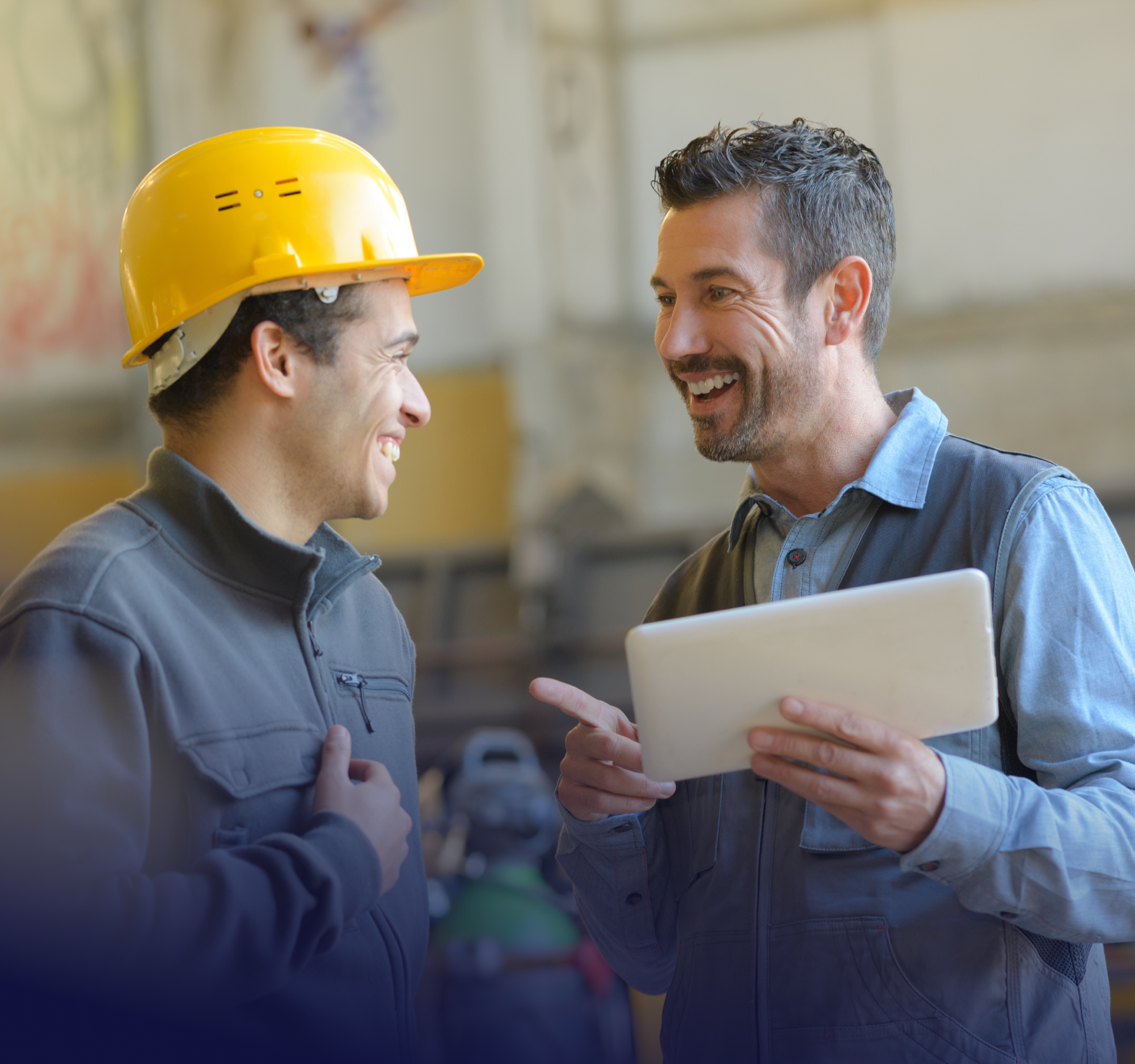 construction worker speaking with manager