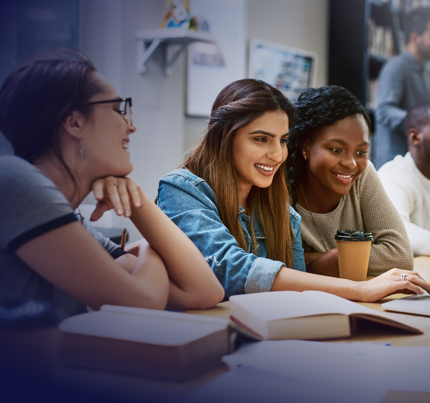 university students working together with books