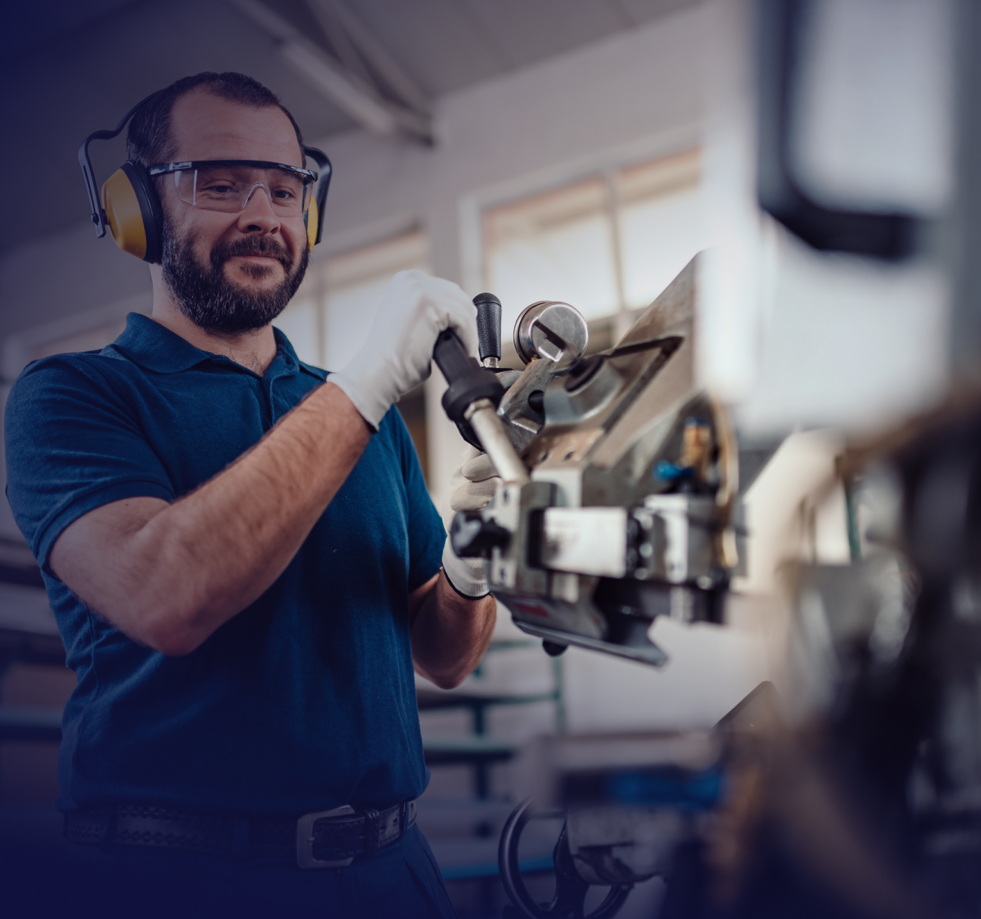 manufacturing worker at a machine