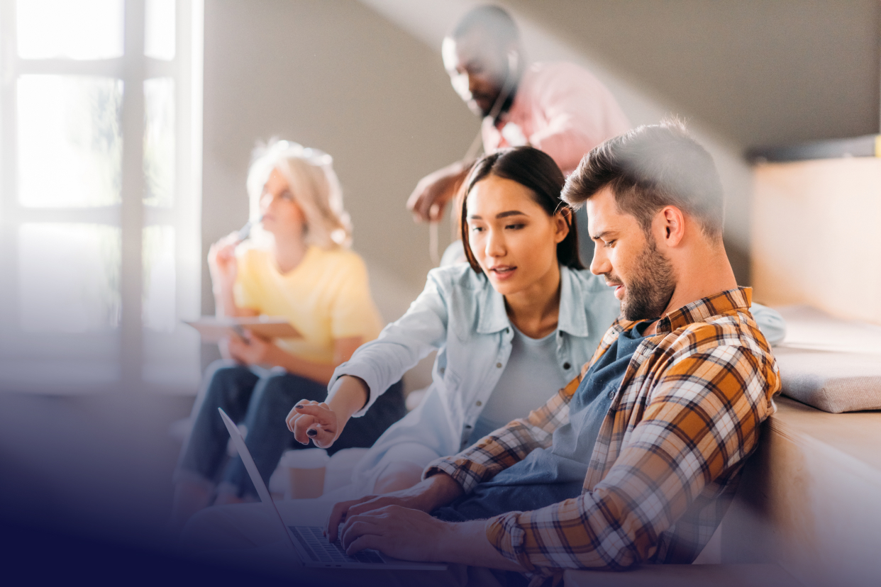 Coworkers looking at computer