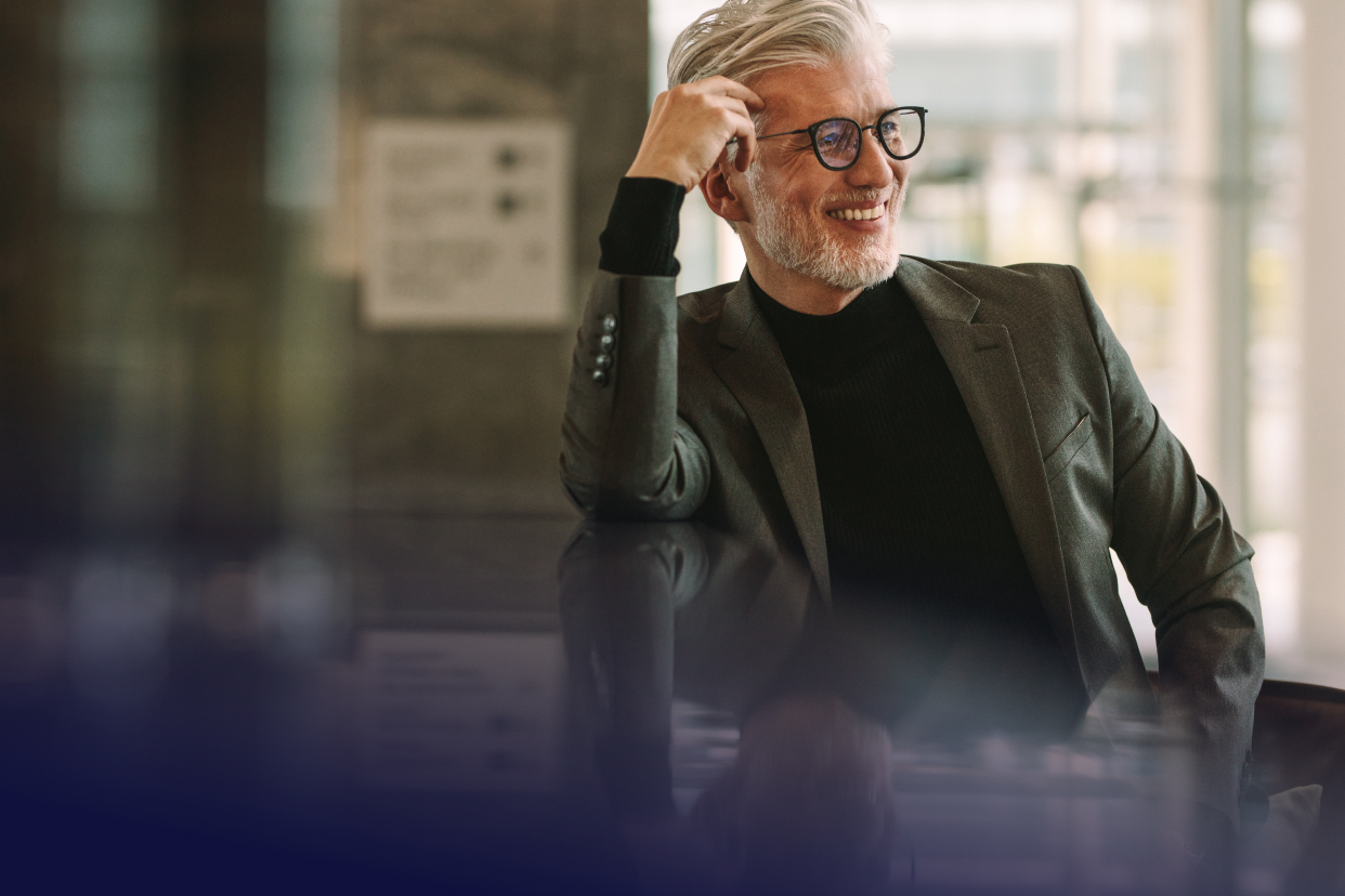 Office worker smiling while sitting in chair