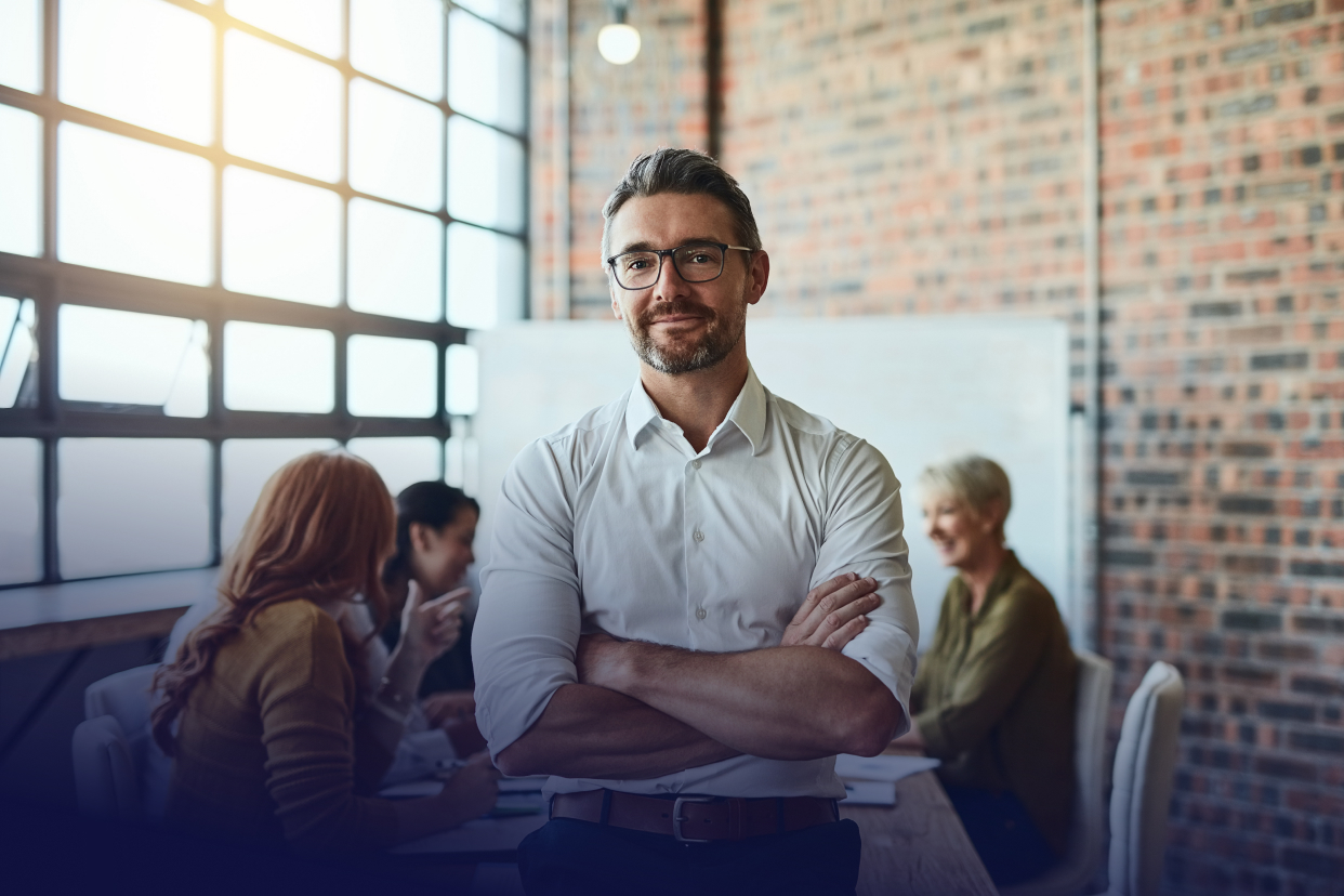 Male coworker standing arms crossed