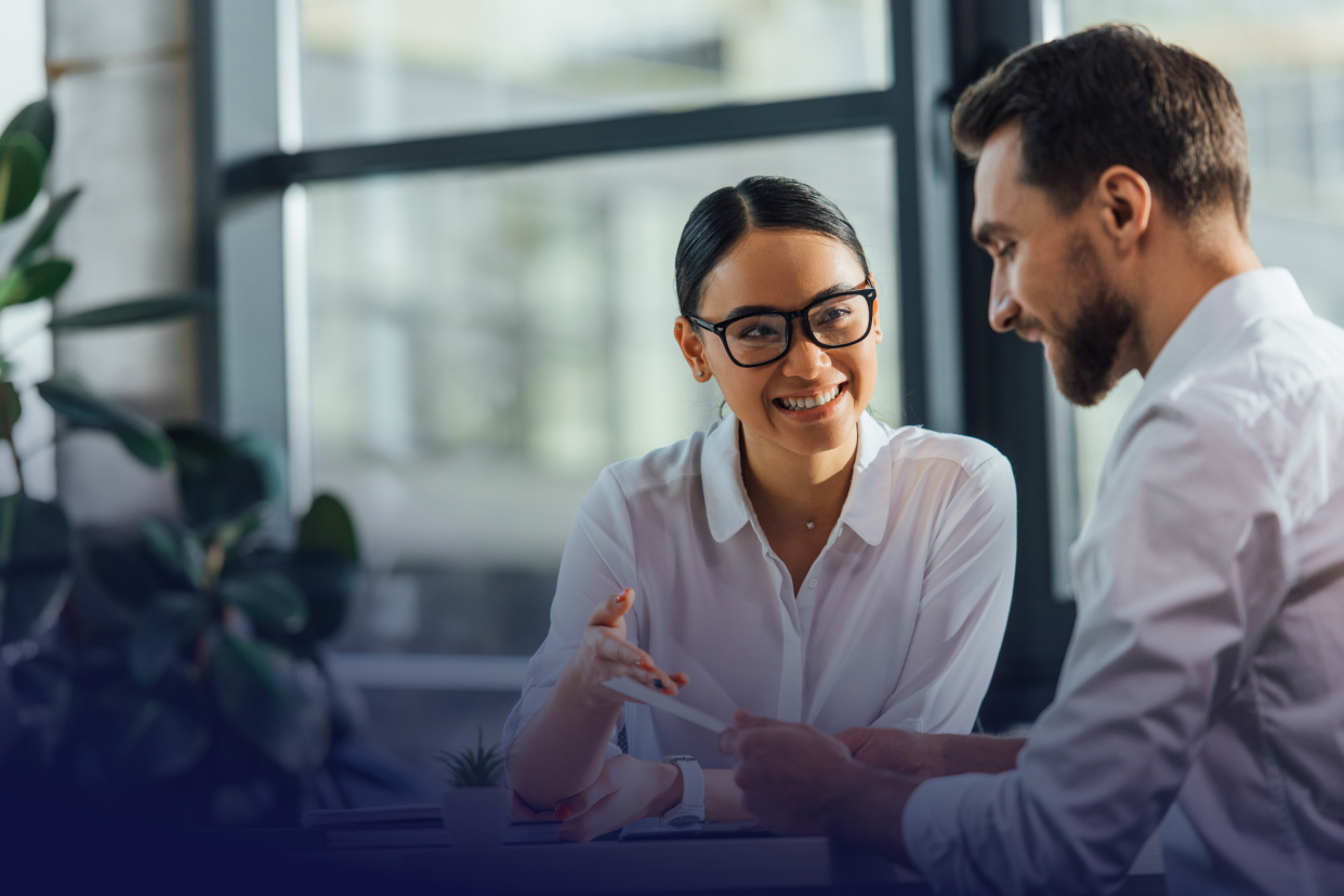 Two office workers smiling