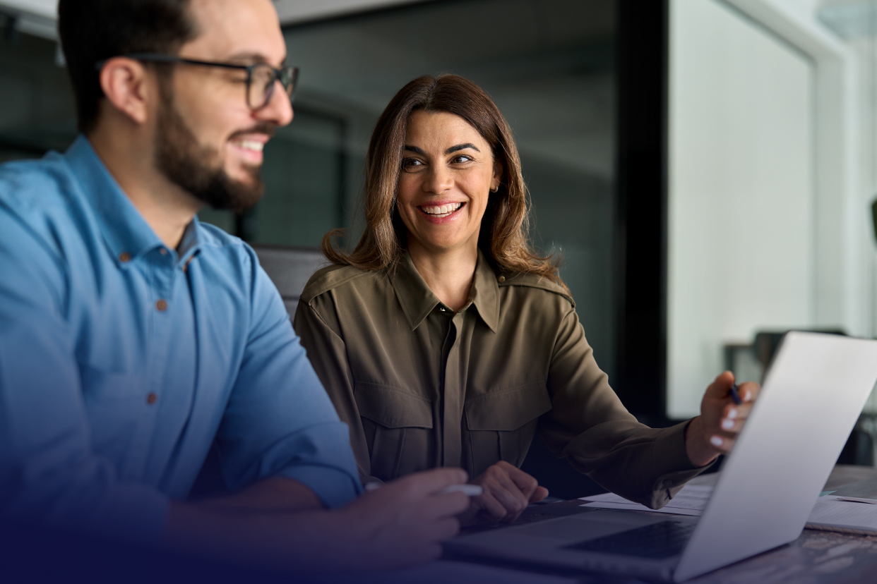 Two office co-workers smiling