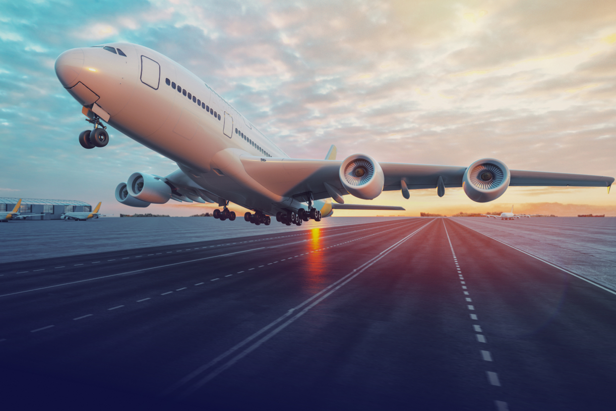 Airplane taking off over runway
