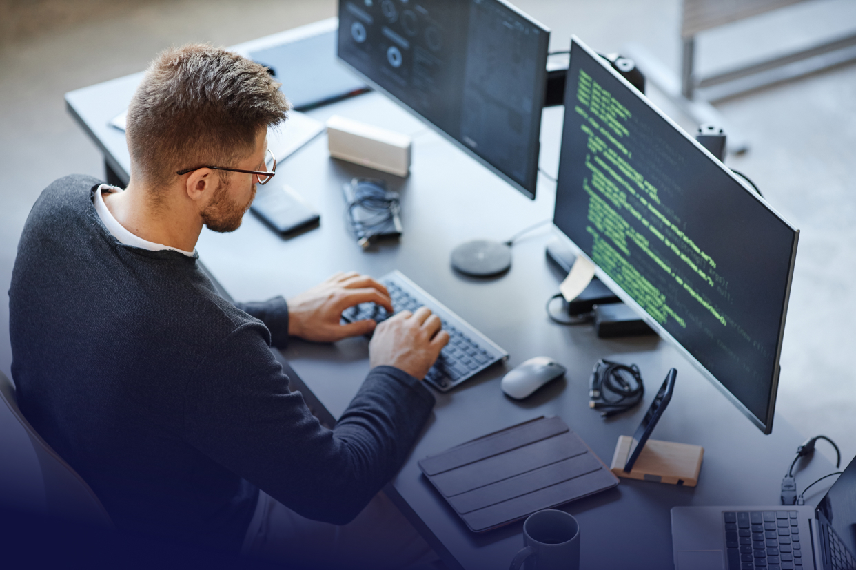 Developer working at desk on computer
