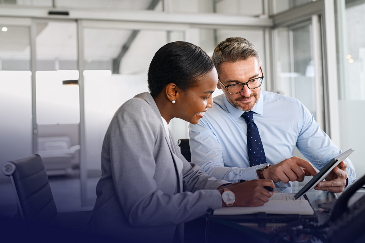 Two coworkers at a desk