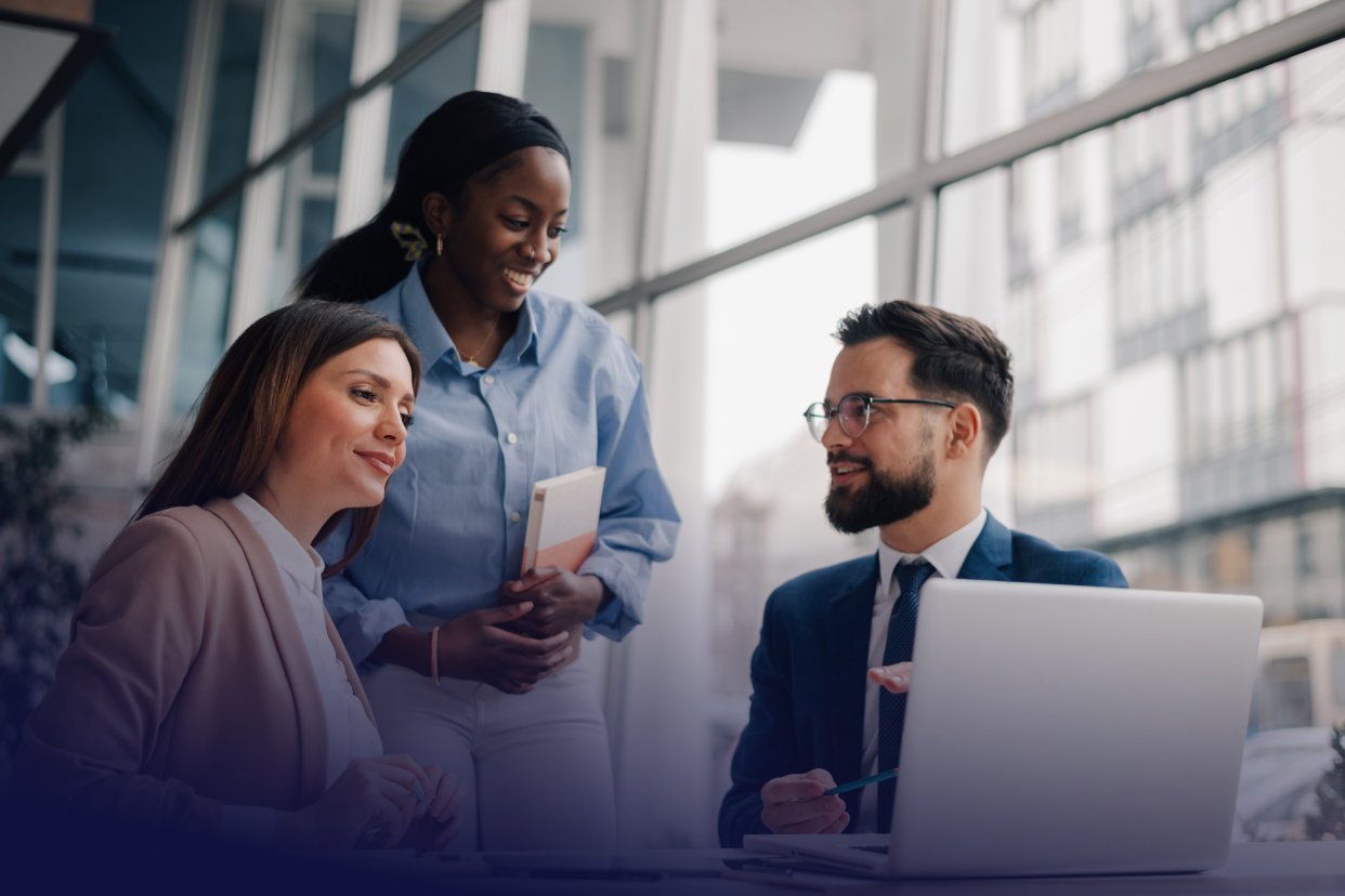 multiple office workers at a desk
