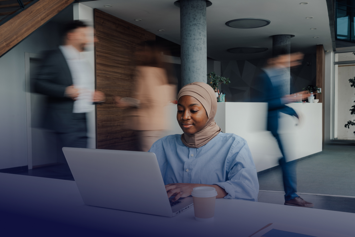 Office worker at desk with laptop