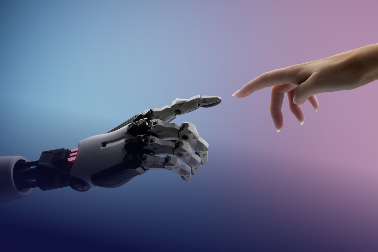 human hand touching robot hand