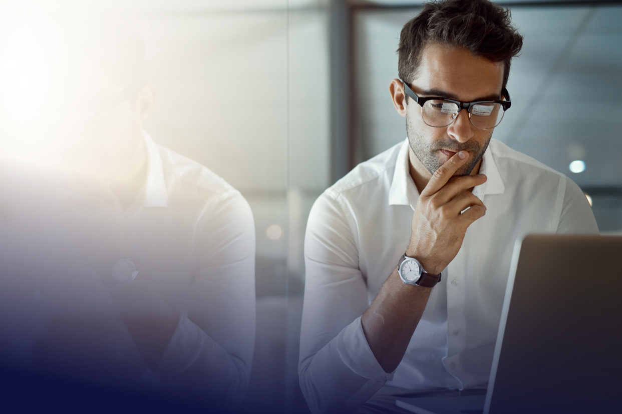 Worker on computer near window
